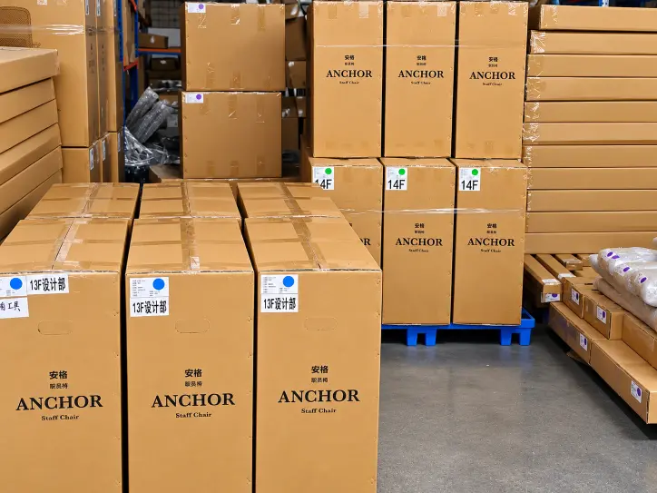 Office chairs packed and palletised for container shipment at the factory